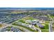 Neighborhood aerial view, showcasing a school and residential homes at 18000 E 100Th Ave, Commerce City, CO 80022