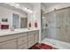 Elegant bathroom with double sinks, a large shower, and modern fixtures at 18000 E 100Th Ave, Commerce City, CO 80022