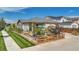 House with a fenced yard, patio, and garden at 18000 E 100Th Ave, Commerce City, CO 80022