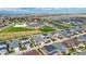 Aerial view of a house in a neighborhood close to a school and playground at 18000 E 100Th Ave, Commerce City, CO 80022