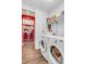 Clean laundry room with washer, dryer, and ample storage at 18000 E 100Th Ave, Commerce City, CO 80022
