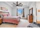 Spacious bedroom with a ceiling fan and large window at 18000 E 100Th Ave, Commerce City, CO 80022