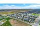 Aerial view of a house and its surroundings, including a nearby school at 18000 E 100Th Ave, Commerce City, CO 80022