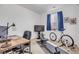 Functional home office featuring a desk, chair and exercise equipment at 18000 E 100Th Ave, Commerce City, CO 80022