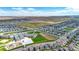 Aerial view of a community featuring various houses and a school at 18000 E 100Th Ave, Commerce City, CO 80022