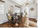 Elegant dining area, hardwood floors, ceiling fan, and kitchen access at 3551 Leyden St, Denver, CO 80207