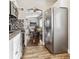 Modern kitchen with stainless steel appliances and stylish backsplash at 3551 Leyden St, Denver, CO 80207