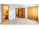 Bright bedroom with wood closets and access to a full bathroom at 12133 Bannock Cir # D, Denver, CO 80234