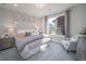 Relaxing bedroom with a king-size bed, decorative headboard, and soft carpeting at 5176 N Quemoy Ct, Aurora, CO 80019
