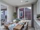 Dining area with a wooden table, chairs, and access to the backyard at 5176 N Quemoy Ct, Aurora, CO 80019