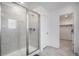 Clean shower with glass enclosure and gray tile at 10246 Uvalda St, Commerce City, CO 80022