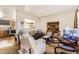 Living room with comfy seating, a TV, and kitchen view at 4238 Freeport Way, Denver, CO 80239