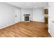 Living room with hardwood floors and fireplace at 1830 Newland Ct # 323, Lakewood, CO 80214
