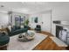 Virtually staged living room with fireplace and hardwood floors at 1830 Newland Ct # 323, Lakewood, CO 80214
