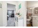 Guest bathroom with toilet, sink, and linen cabinet at 9630 W 105Th Ave, Broomfield, CO 80021