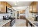 Eat-in kitchen with ample cabinet space and tile flooring at 9630 W 105Th Ave, Broomfield, CO 80021