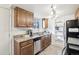 Updated kitchen featuring granite countertops and wood cabinets at 9630 W 105Th Ave, Broomfield, CO 80021