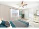 Bedroom with ceiling fan, window, and sliding door to closet at 9216 W 107Th Pl, Westminster, CO 80021