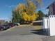 Parking lot with cars and autumn leaves at 12172 Huron St # 207, Denver, CO 80234