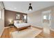 Bright bedroom with hardwood floors and ensuite bathroom at 8152 E 49Th Pl, Denver, CO 80238