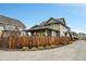 Craftsman style home with fenced backyard and driveway at 8152 E 49Th Pl, Denver, CO 80238