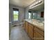 Bathroom with double vanity, toilet, and shower at 23671 E Alabama Dr, Aurora, CO 80018