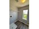 Laundry room with shelving and drain at 23671 E Alabama Dr, Aurora, CO 80018