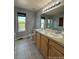 Bathroom with double vanity, toilet, and shower at 23671 E Alabama Dr, Aurora, CO 80018