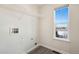 Laundry room with shelving, vinyl flooring and window at 23671 E Alabama Dr, Aurora, CO 80018
