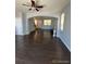 Open living room with dark hardwood floors and a view to the kitchen at 23671 E Alabama Dr, Aurora, CO 80018