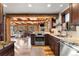 Open kitchen with stainless steel appliances and granite countertops at 878 American Way, Breckenridge, CO 80424