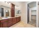 Bathroom with double vanity, large mirror, and access to a walk-in closet at 1178 Freedom Way, Castle Rock, CO 80109