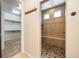 Walk-in shower with pebble floor and tile surround at 1178 Freedom Way, Castle Rock, CO 80109