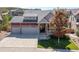 Beautiful two-story home with a spacious driveway and landscaping at 1178 Freedom Way, Castle Rock, CO 80109