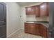 Laundry room with built-in cabinets and countertop at 1178 Freedom Way, Castle Rock, CO 80109