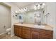 Double vanity bathroom with a large mirror and tile flooring at 1178 Freedom Way, Castle Rock, CO 80109