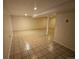 Unfinished basement area with tiled floors at 12784 Grandview Dr, Longmont, CO 80504