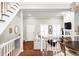 Bright living room with hardwood floors, white fireplace, and stairs at 483 Josephine St, Denver, CO 80206