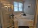 Main bathroom with a large soaking tub and separate shower at 19232 E Adriatic Pl, Aurora, CO 80013