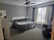 Comfortable main bedroom with a large window and en-suite bathroom at 19232 E Adriatic Pl, Aurora, CO 80013