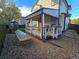 Back patio with seating area and garden at 19232 E Adriatic Pl, Aurora, CO 80013