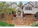 Brick house with a large front porch and landscaping at 12000 W 29Th Pl, Wheat Ridge, CO 80215