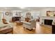 Open living space with hardwood floors and multiple seating areas at 12000 W 29Th Pl, Wheat Ridge, CO 80215