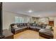 Open concept basement with a large sectional sofa at 12000 W 29Th Pl, Wheat Ridge, CO 80215