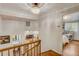 Upstairs hallway offering views into living areas and bedrooms at 12000 W 29Th Pl, Wheat Ridge, CO 80215
