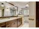 Elegant bathroom with dual sinks and a large mirror at 12000 W 29Th Pl, Wheat Ridge, CO 80215
