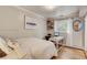 Cozy bedroom with hardwood floors, window seating, and built in desk at 12000 W 29Th Pl, Wheat Ridge, CO 80215