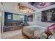 Bedroom with unique ceiling decor, plush seating, and ample natural light at 12000 W 29Th Pl, Wheat Ridge, CO 80215