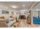 Open concept living and dining area with hardwood floors at 12000 W 29Th Pl, Wheat Ridge, CO 80215