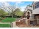 Brick home's side view, showing landscaping and walkway at 12000 W 29Th Pl, Wheat Ridge, CO 80215